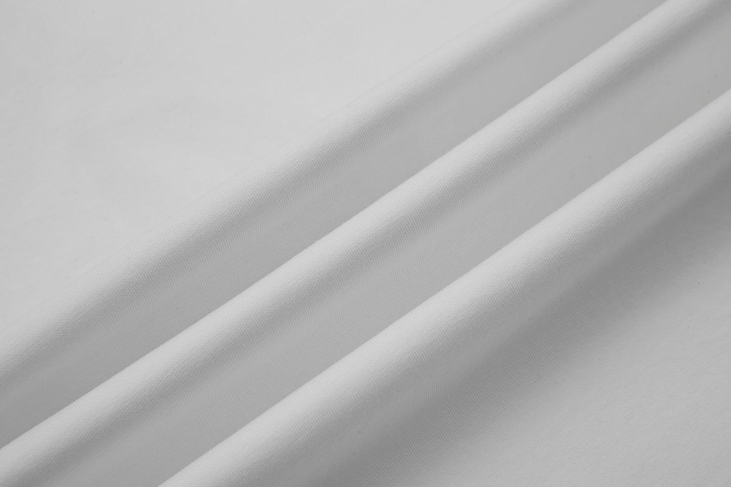 White fabric texture with folds