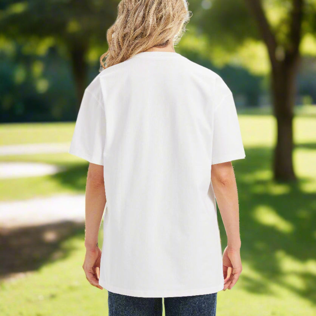Back of a woman in a white tee