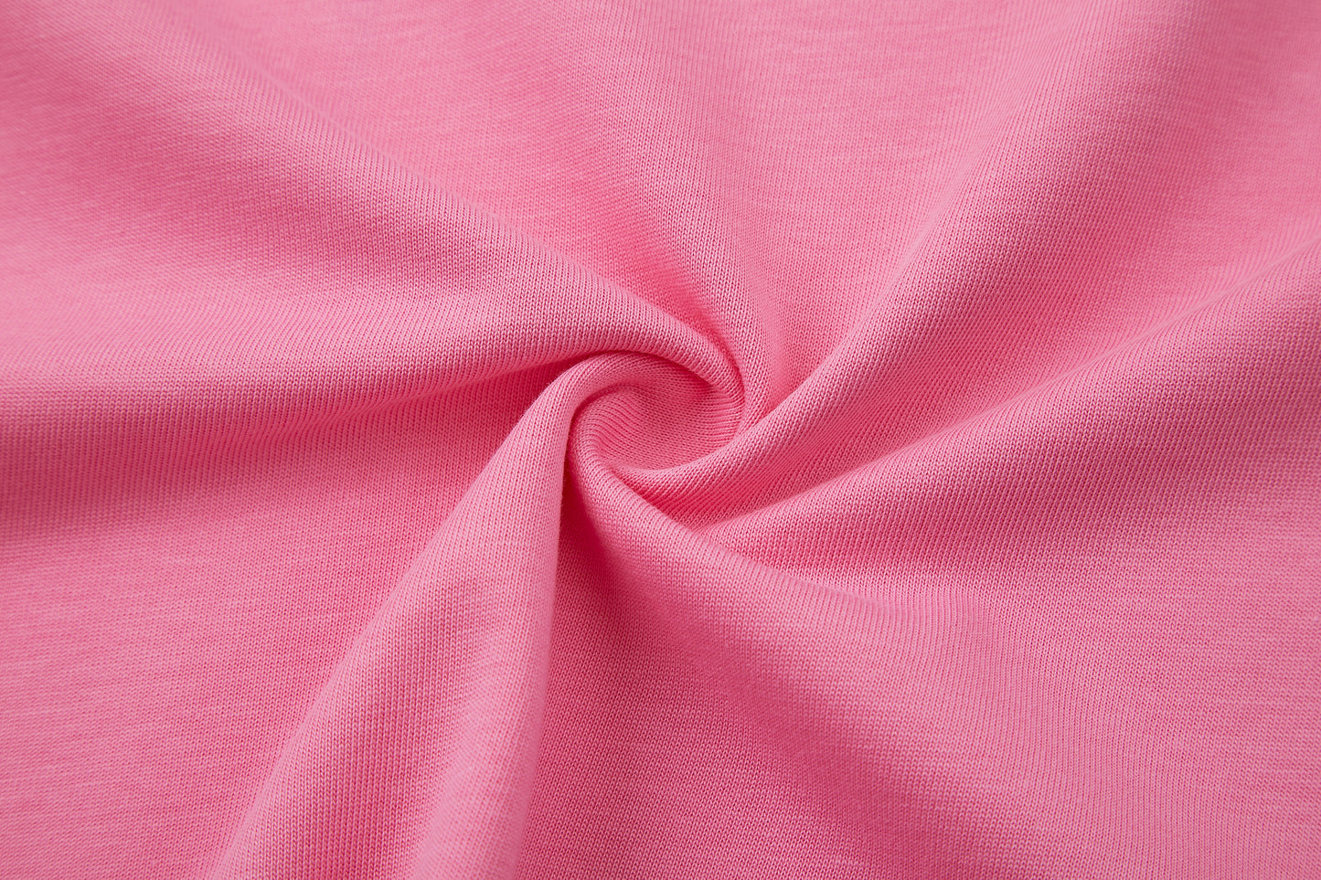 Close-up of pink fabric with a swirl pattern