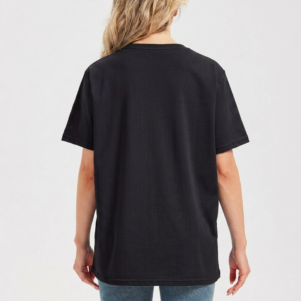 Person wearing a black t-shirt on a plain background