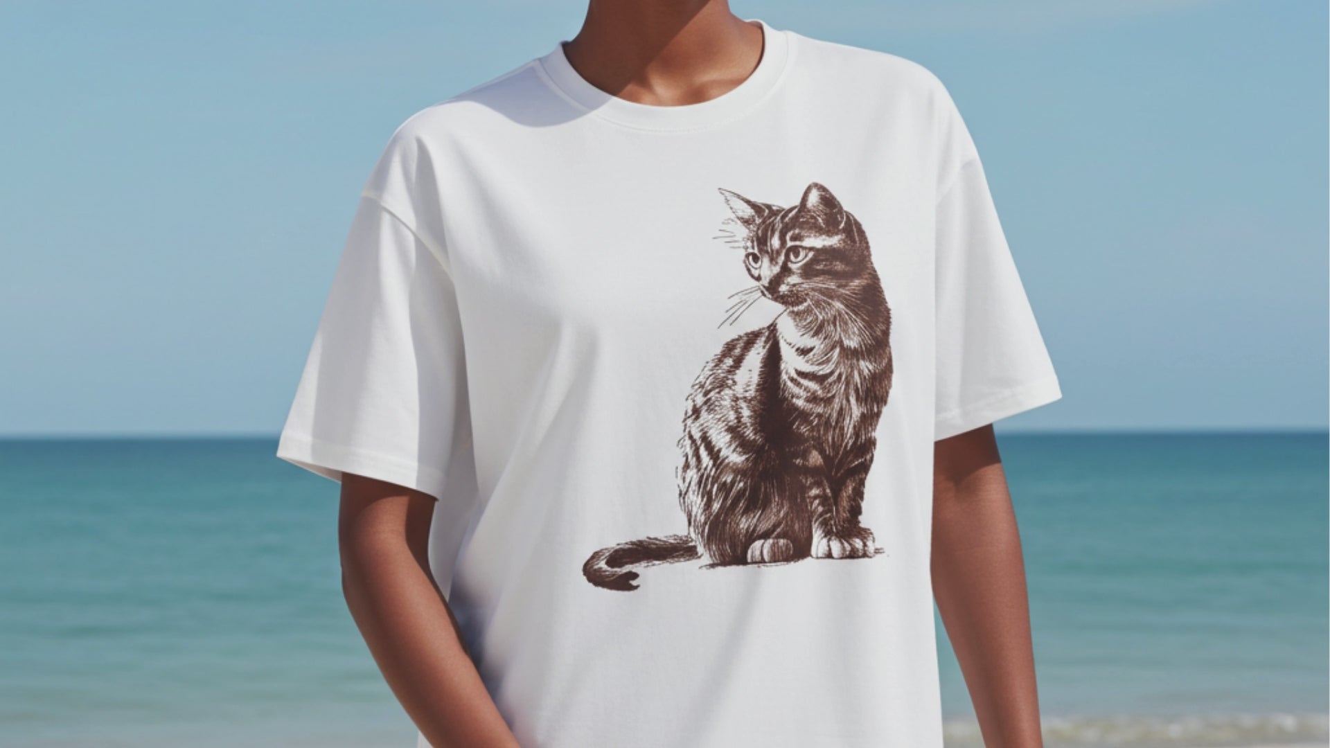 Woman in a white tee with a cat graphic print